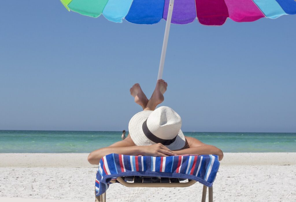 sest states for tax-free retirement, this photo shows a person laying on a beach